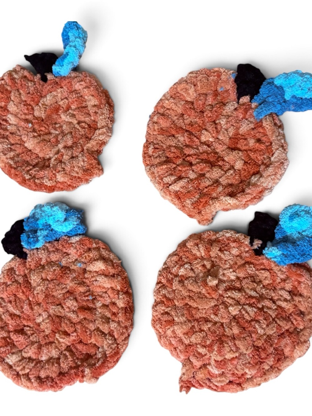 Crocheted Coral Pumpkin Coasters with Blue Accent - Home Accents